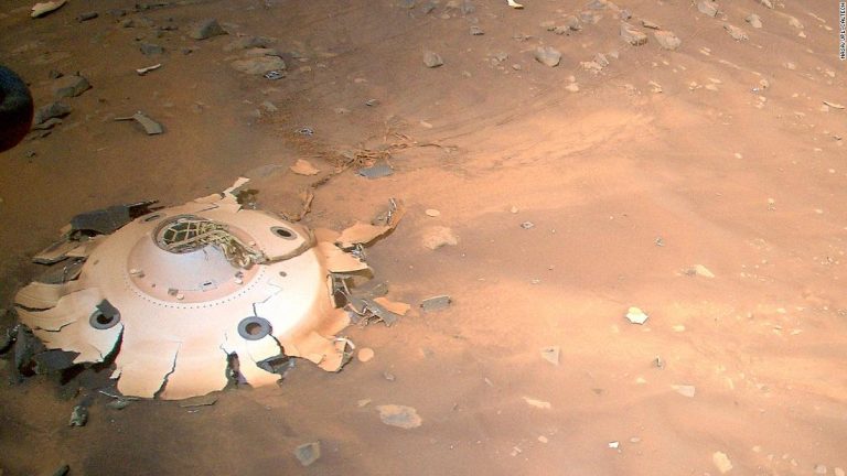 An Ingenuity helicopter takes pictures of a debris field on Mars